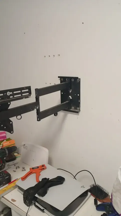 Soporte articulado de televisión anclado a la pared